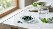 Premium spirulina and chlorella algae tablets arranged on marble surface representing the healthiest daily algae supplement for complete nutrition