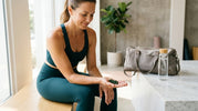 Person holding RECOVERYbits chlorella tablets after workout for natural post-workout recovery support