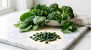 RECOVERYbits chlorella algae tablets displayed alongside fresh vegetables, illustrating concentrated nutrition beyond traditional greens
