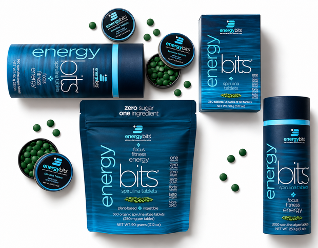 Energy Bits supplement products from Energy Bits, including a blue pouch, a blue tub, a blue box, and two small round tins of capsules, arranged on a white background with scattered green capsules.