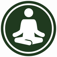 Person meditating to represent balance and relaxation supported by chlorella tabs.